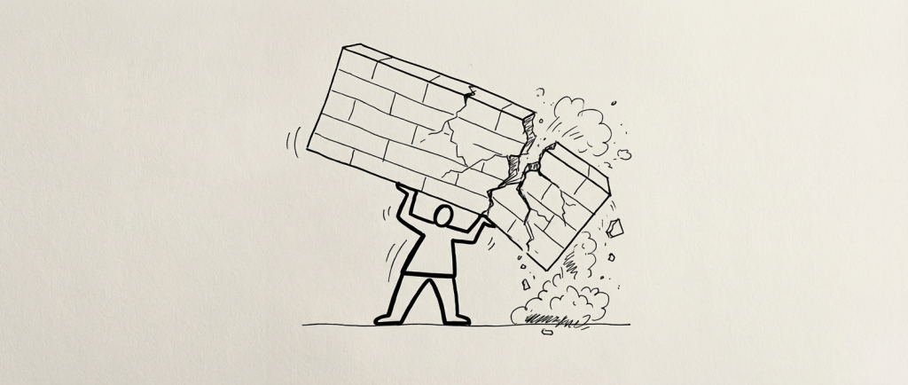 A stylized person lifting and breaking a large brick wall overhead.